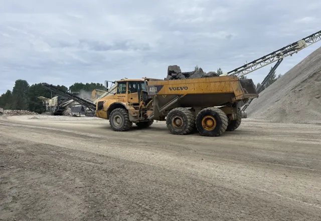 Articulated hauler at the crusher — 2026