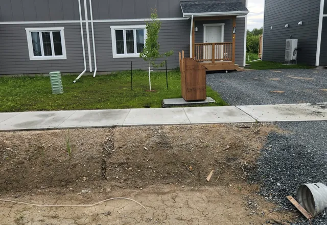 Staff housing sidewalks and pads, Moosonee — 2025
