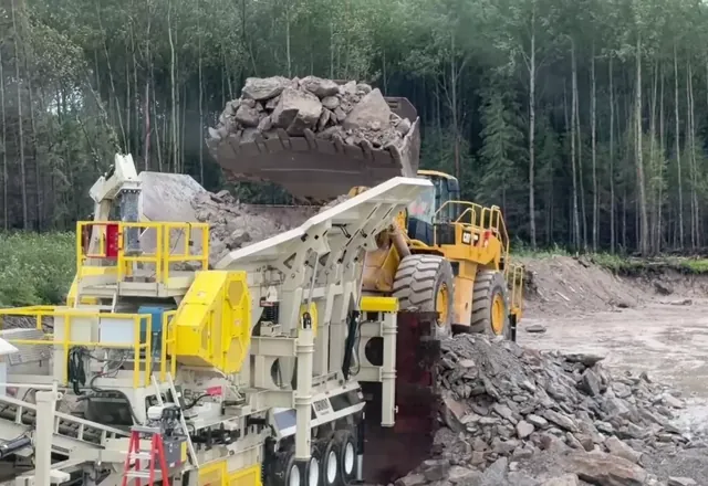 Loader feeding the crusher — 2026