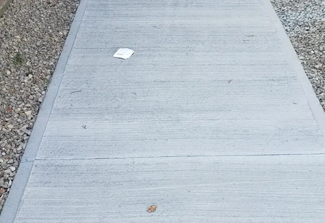 Concrete sidewalk, government building, Moosonee — 2022