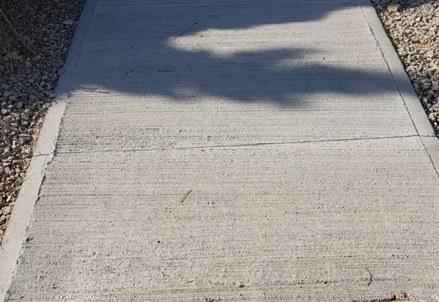 Concrete sidewalk with tactile plate, Moosonee — 2022